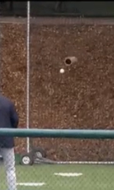 Cal pitcher pulls off a near-impossible trick shot